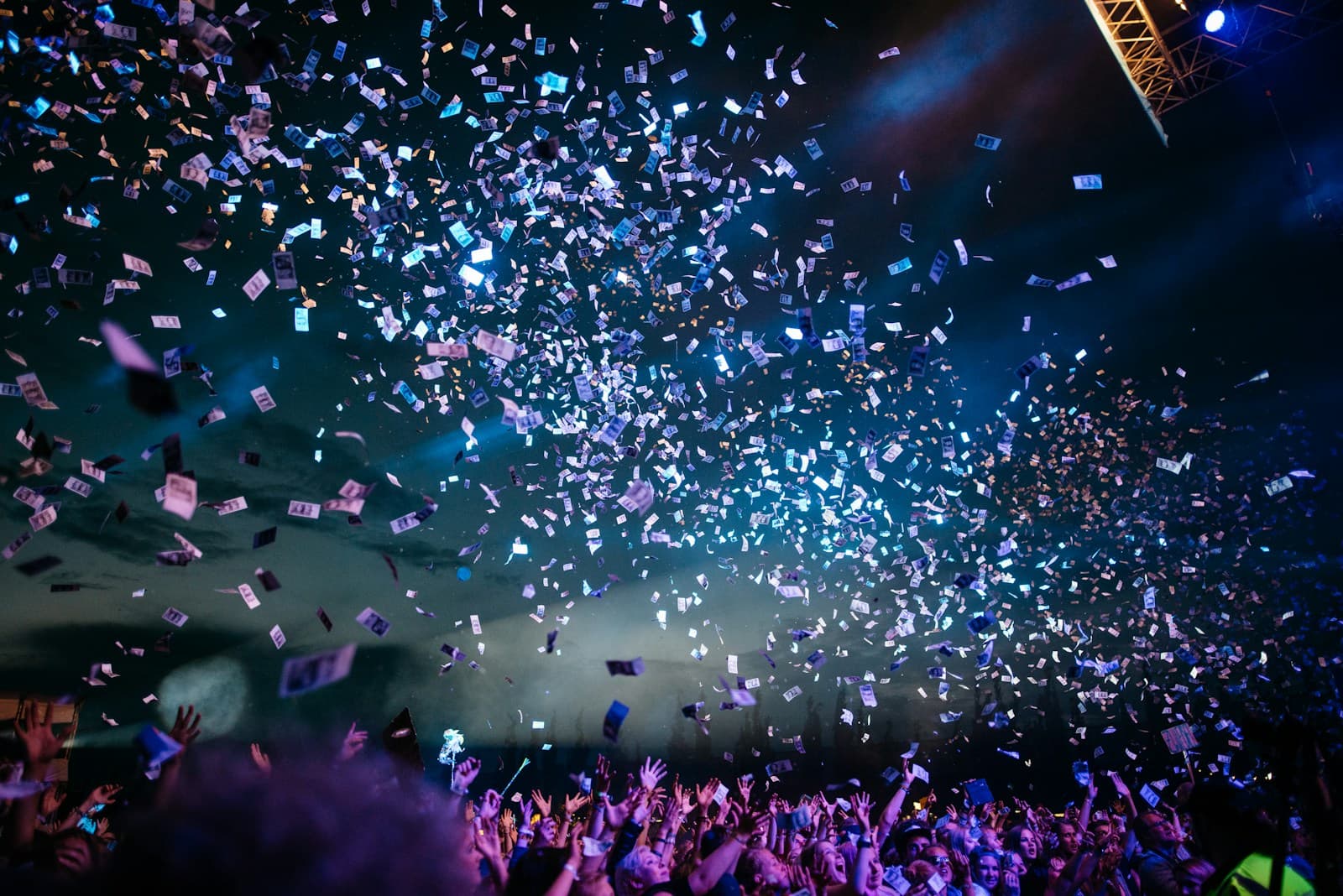 Colorful confetti on a teal background